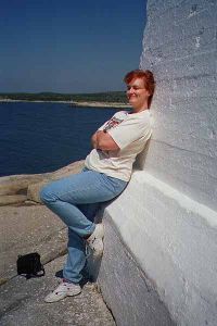 Leaning against lighthouse